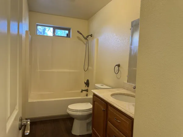 a view of a two chairs in the patio