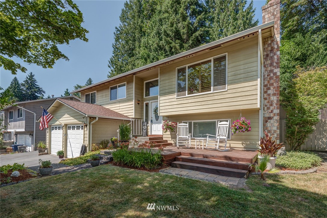 2001 172nd Place Southeast Bothell, WA 98012 - Photo 3 of 32 a front view of a house with a garden