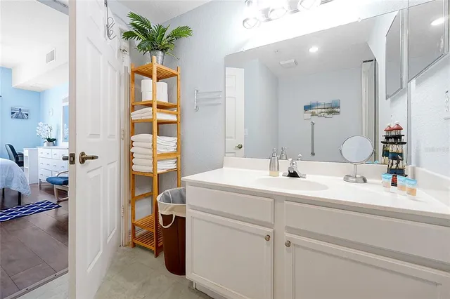 a bathroom with a sink a vanity and a mirror