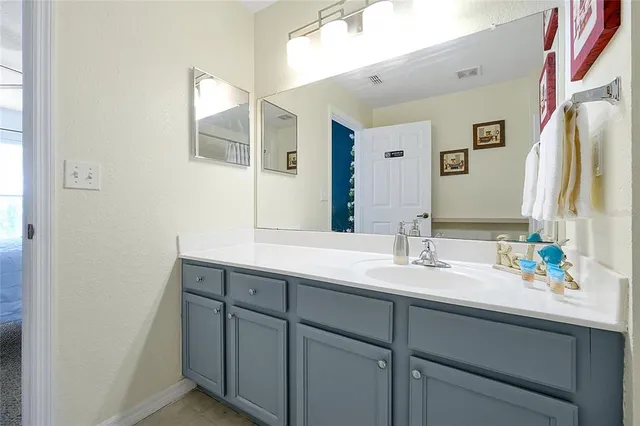 a view of washer and dryer with bathroom in the background