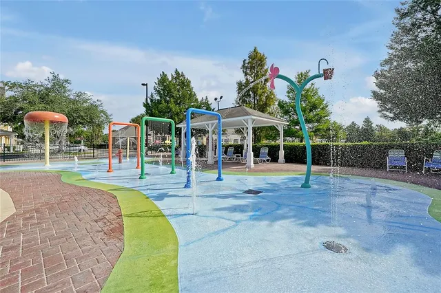 an outdoor space with lots of palm trees