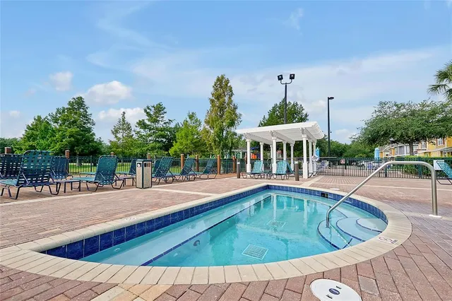a view of a chairs and table in a patio