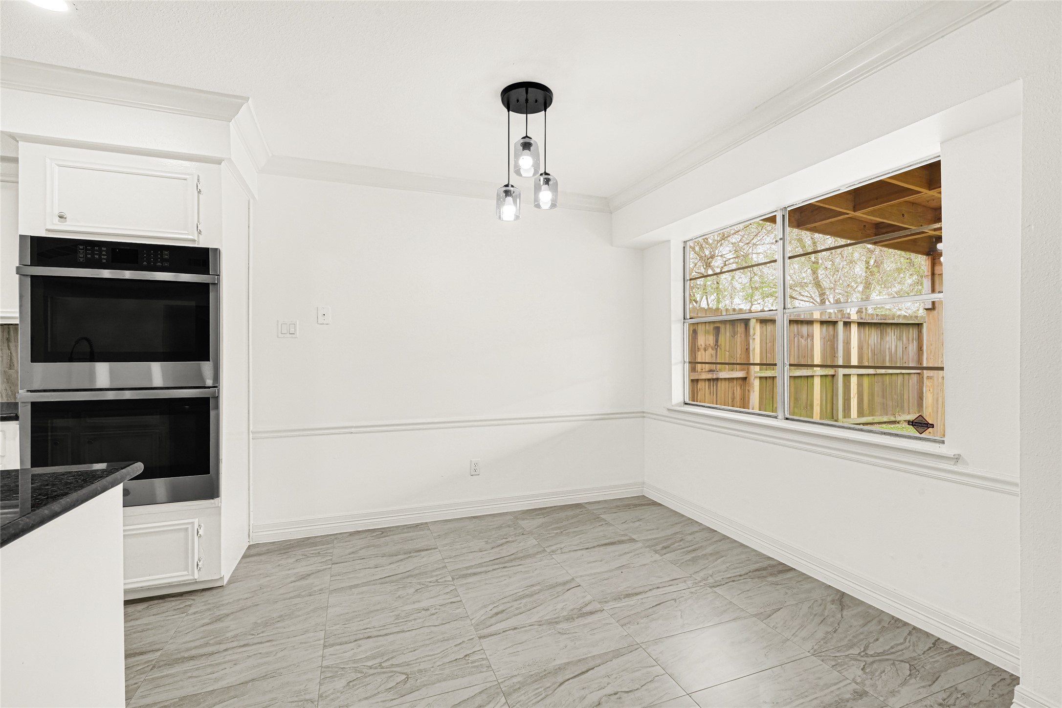 4102 Townes Forest Road Friendswood, TX 77546 - Photo 11 of 50 Bright dining space with easy access to the kitchen and living areas, perfect for daily meals or hosting.