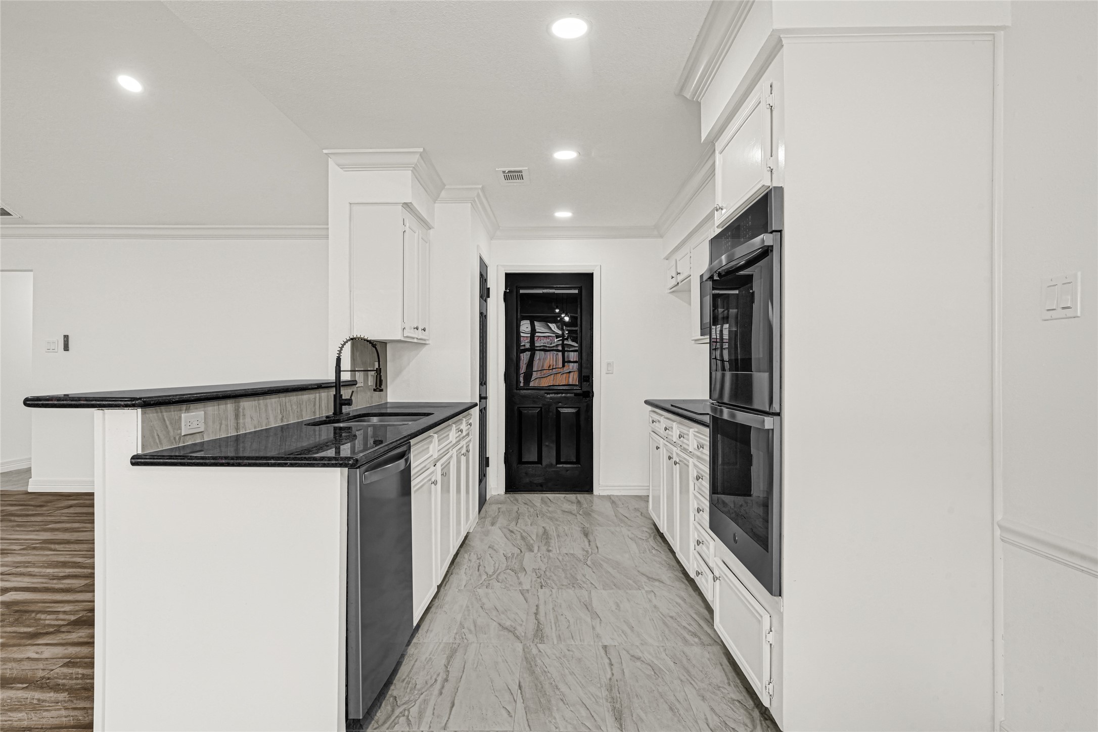4102 Townes Forest Road Friendswood, TX 77546 - Photo 12 of 50 Functional kitchen setup with ample room for movement and a layout designed for convenience.