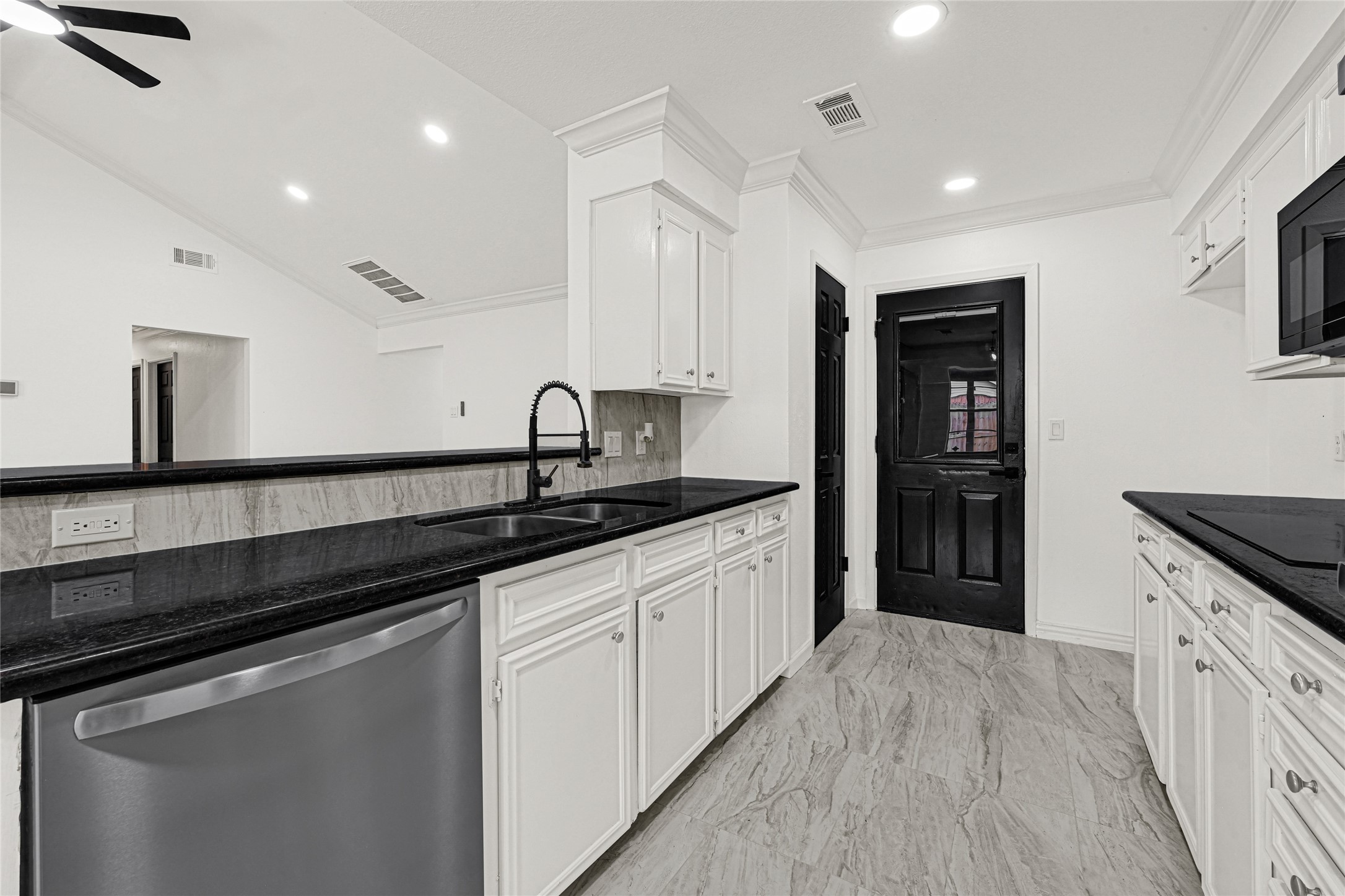 4102 Townes Forest Road Friendswood, TX 77546 - Photo 13 of 50 Kitchen featuring updated cabinetry, sleek countertops, and a clean, contemporary look.