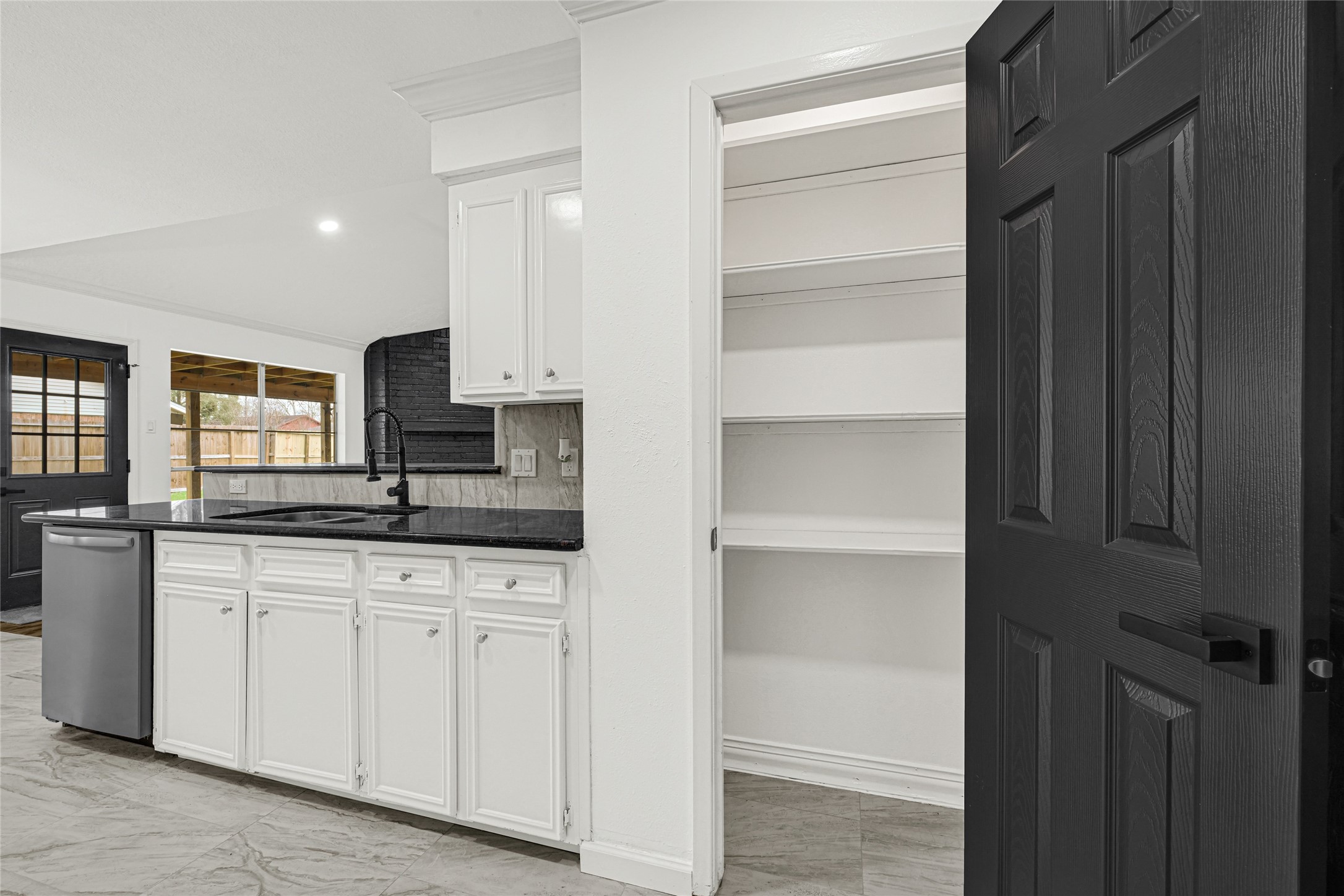 4102 Townes Forest Road Friendswood, TX 77546 - Photo 15 of 50 Additional storage with built-in shelving, offering flexibility and organization options.