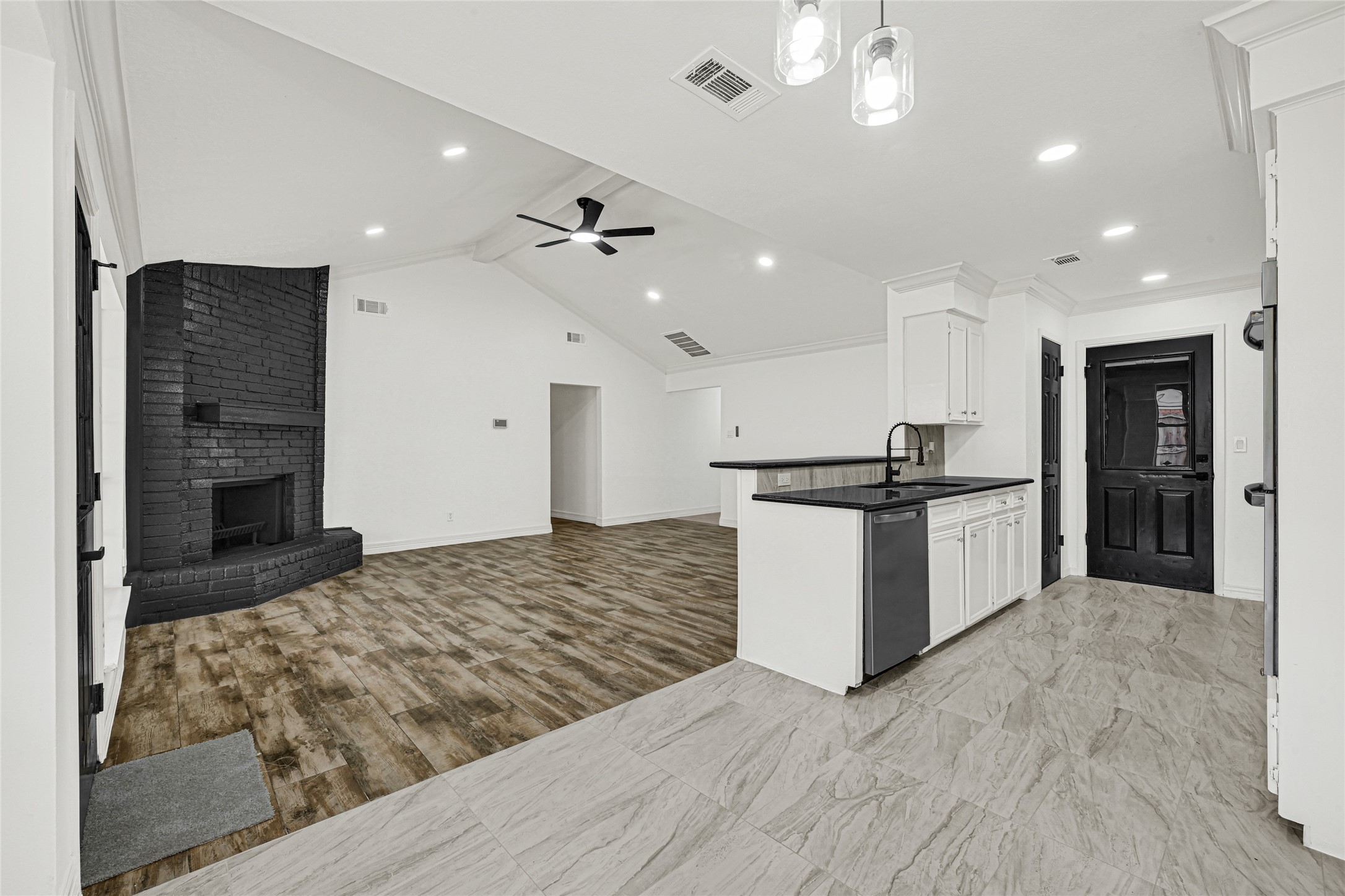 4102 Townes Forest Road Friendswood, TX 77546 - Photo 16 of 50 Spacious open layout connecting the living area and kitchen, ideal for everyday living and entertaining.
