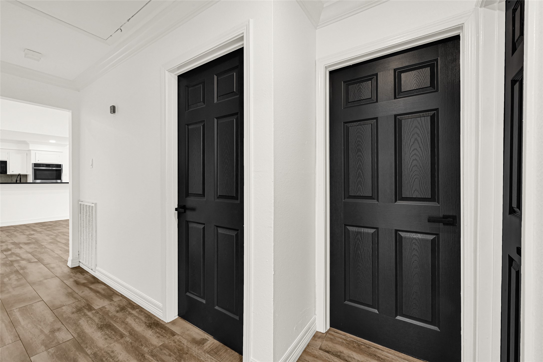 4102 Townes Forest Road Friendswood, TX 77546 - Photo 19 of 50 Central hallway connecting key areas of the home with a practical and efficient layout.