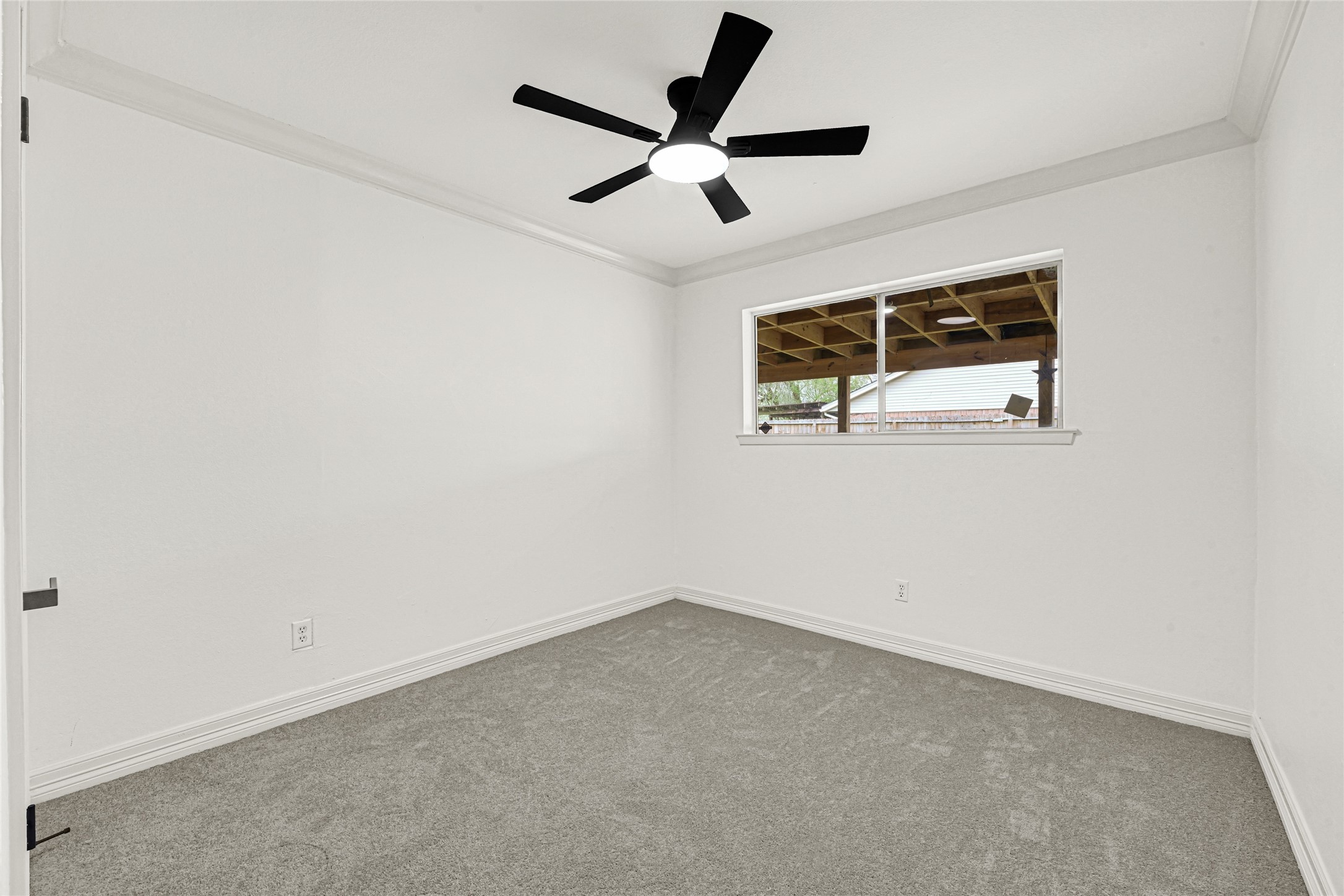 4102 Townes Forest Road Friendswood, TX 77546 - Photo 20 of 50 Comfortable bedroom with neutral tones, ceiling fan, and natural light.