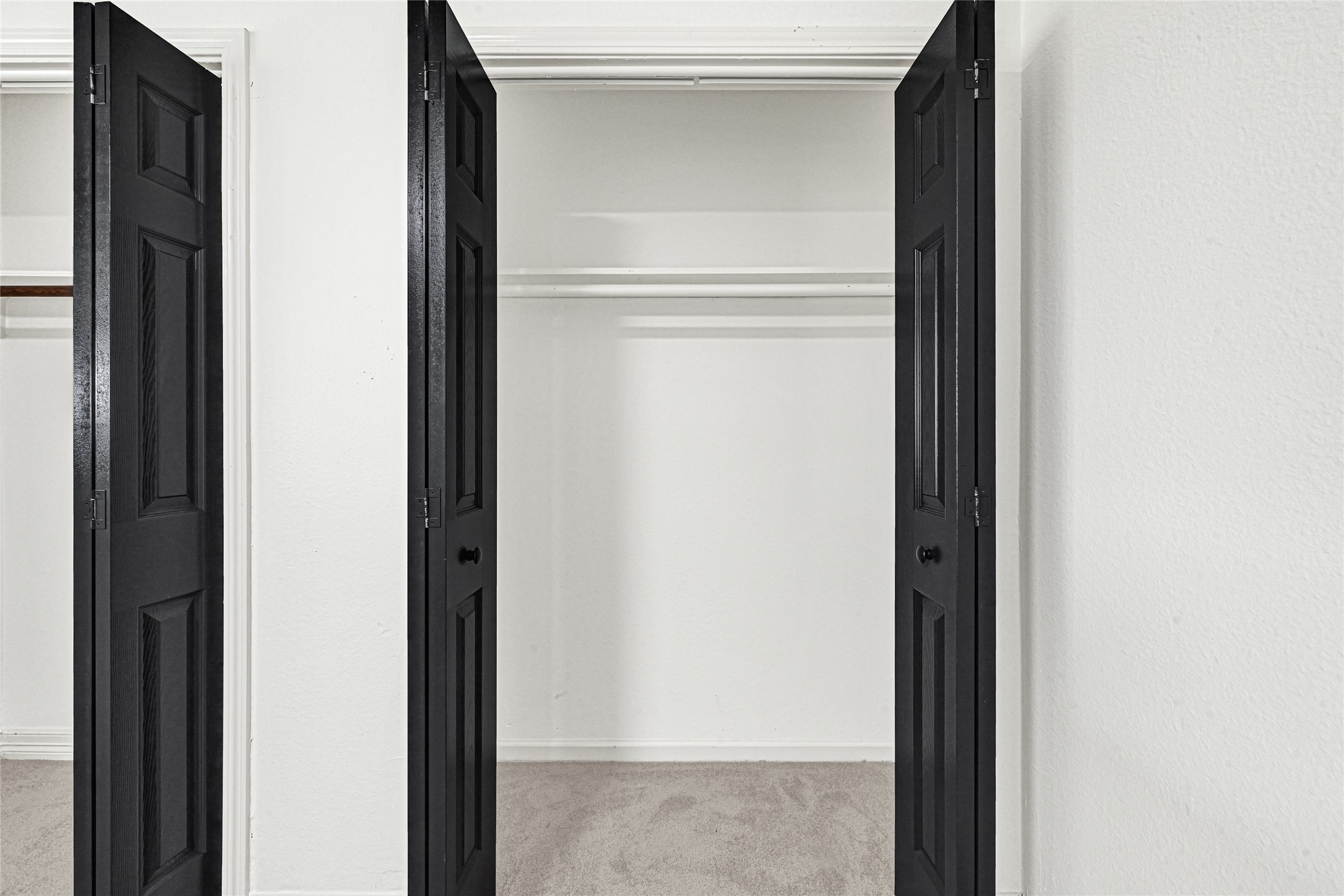 4102 Townes Forest Road Friendswood, TX 77546 - Photo 26 of 50 Spacious closet with built-in shelving and hanging space for efficient organization.
