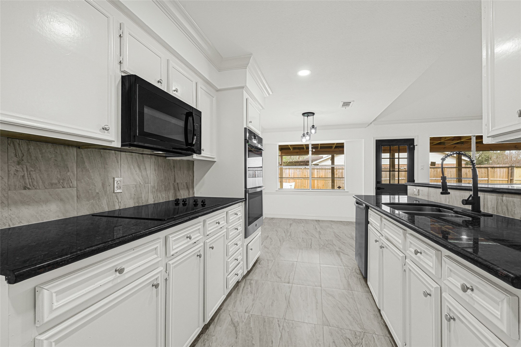 4102 Townes Forest Road Friendswood, TX 77546 - Photo 3 of 50 Well-laid-out kitchen with generous counter space, updated cabinetry, and easy flow into the dining area.