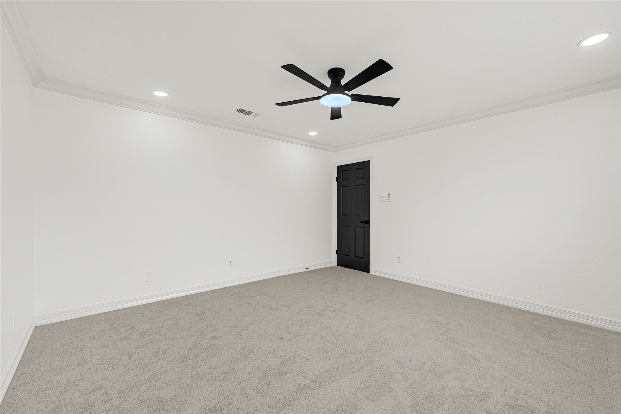 4102 Townes Forest Road Friendswood, TX 77546 - Photo 34 of 50 Generous primary bedroom with modern ceiling fan and ample space.