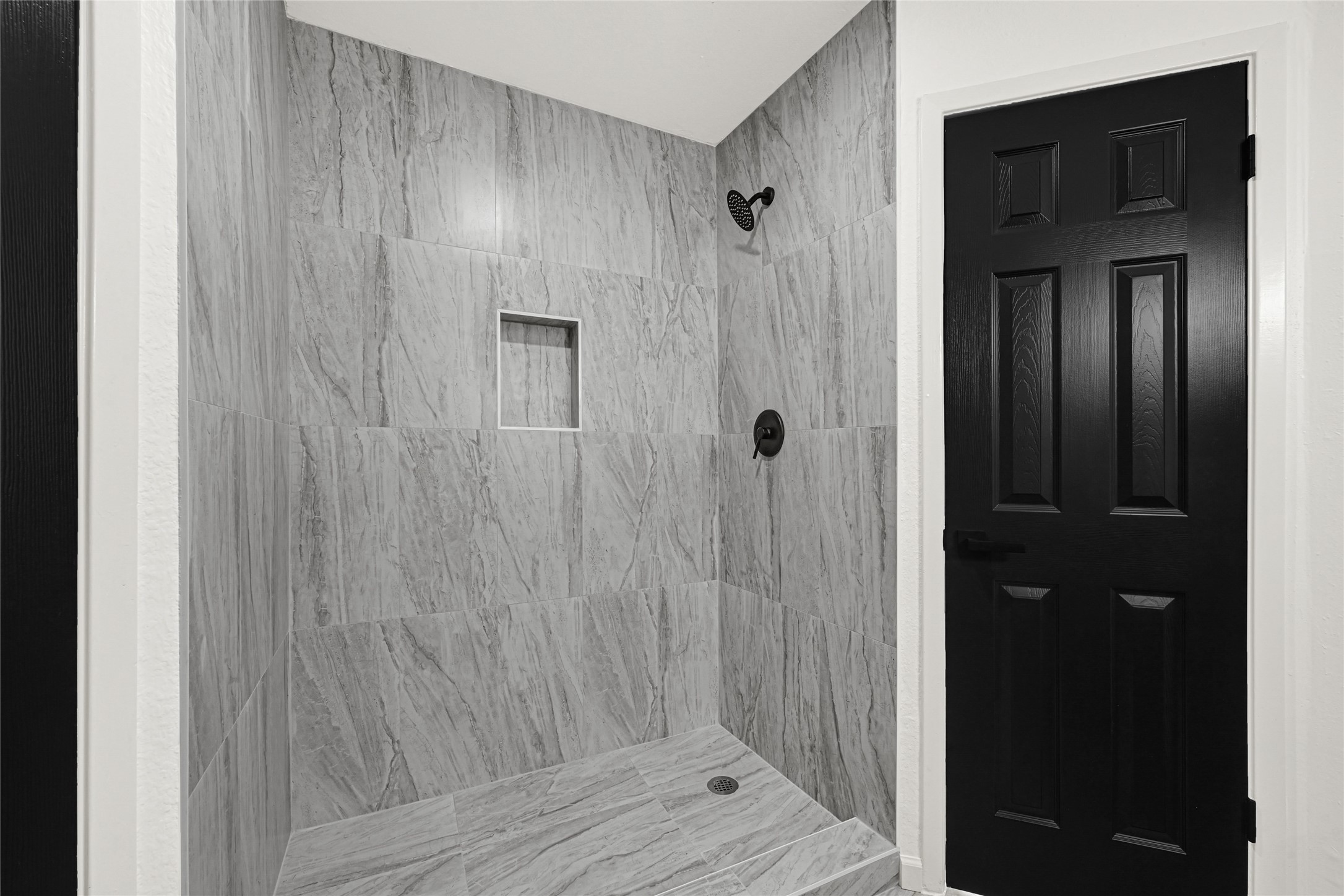 4102 Townes Forest Road Friendswood, TX 77546 - Photo 35 of 50 Walk-in shower with updated tile surround and clean, contemporary design.