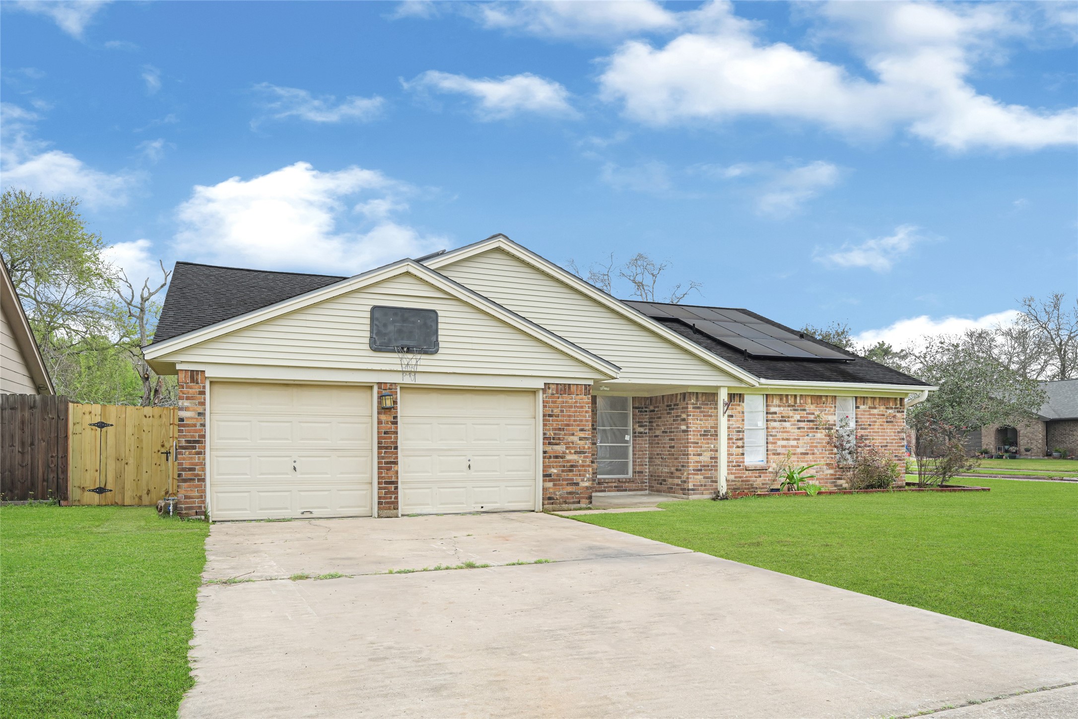 4102 Townes Forest Road Friendswood, TX 77546 - Photo 48 of 50 Front elevation featuring a two-car garage and extended driveway.