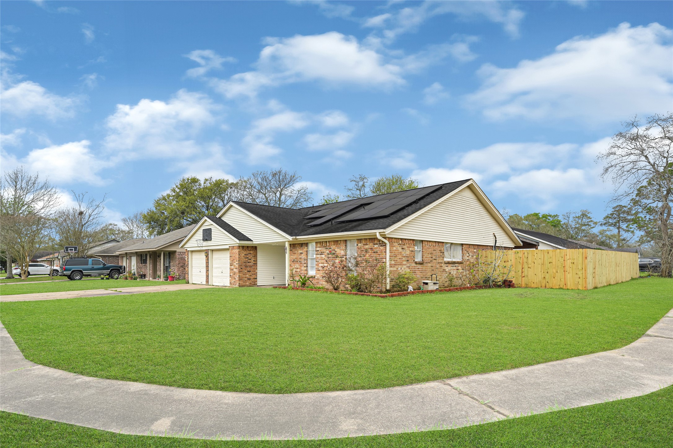4102 Townes Forest Road Friendswood, TX 77546 - Photo 49 of 50 Corner perspective showcasing curb appeal and spacious lot.