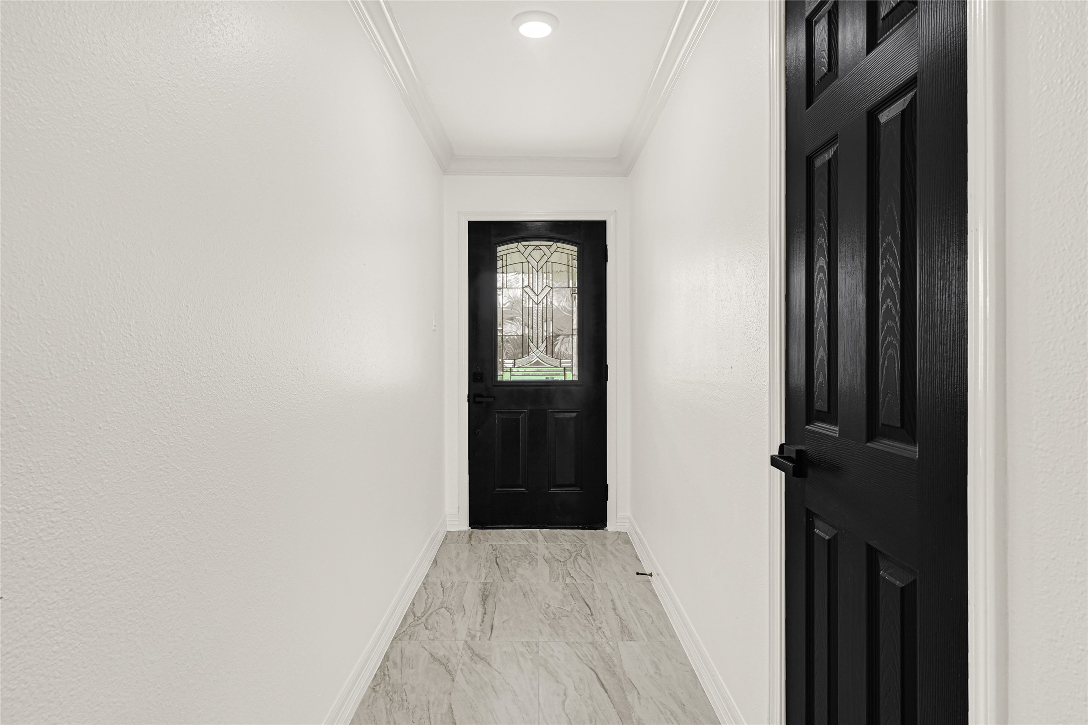 4102 Townes Forest Road Friendswood, TX 77546 - Photo 6 of 50 Welcoming entryway with neutral tones and a clean layout that flows seamlessly into the main living areas.