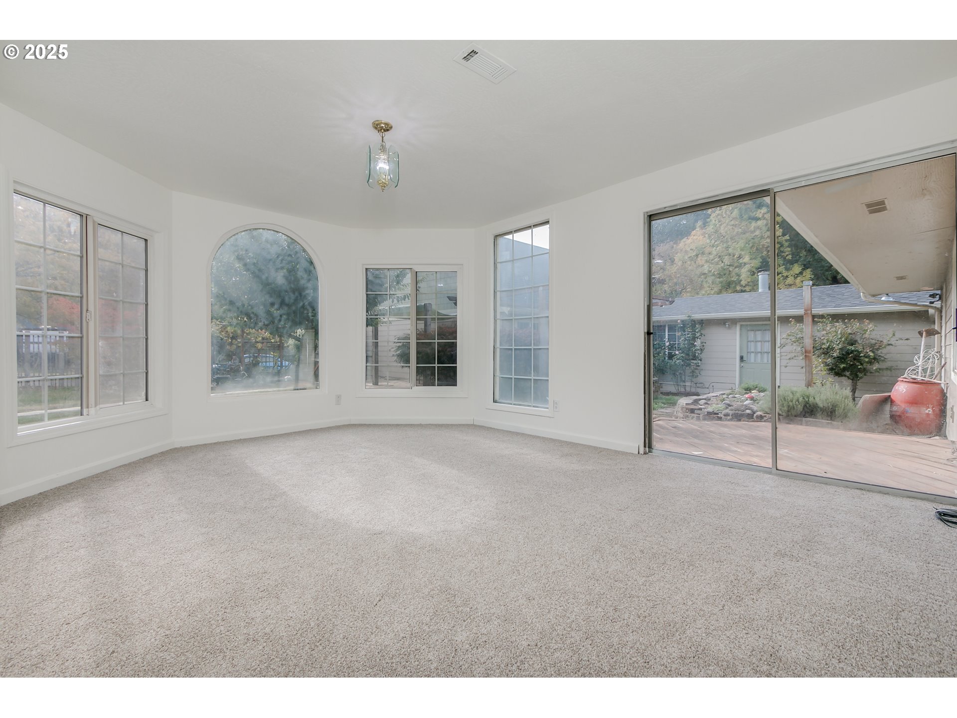 1755 East 43rd Avenue Eugene, OR 97405 - Photo 13 of 34 a view of an empty room with a window