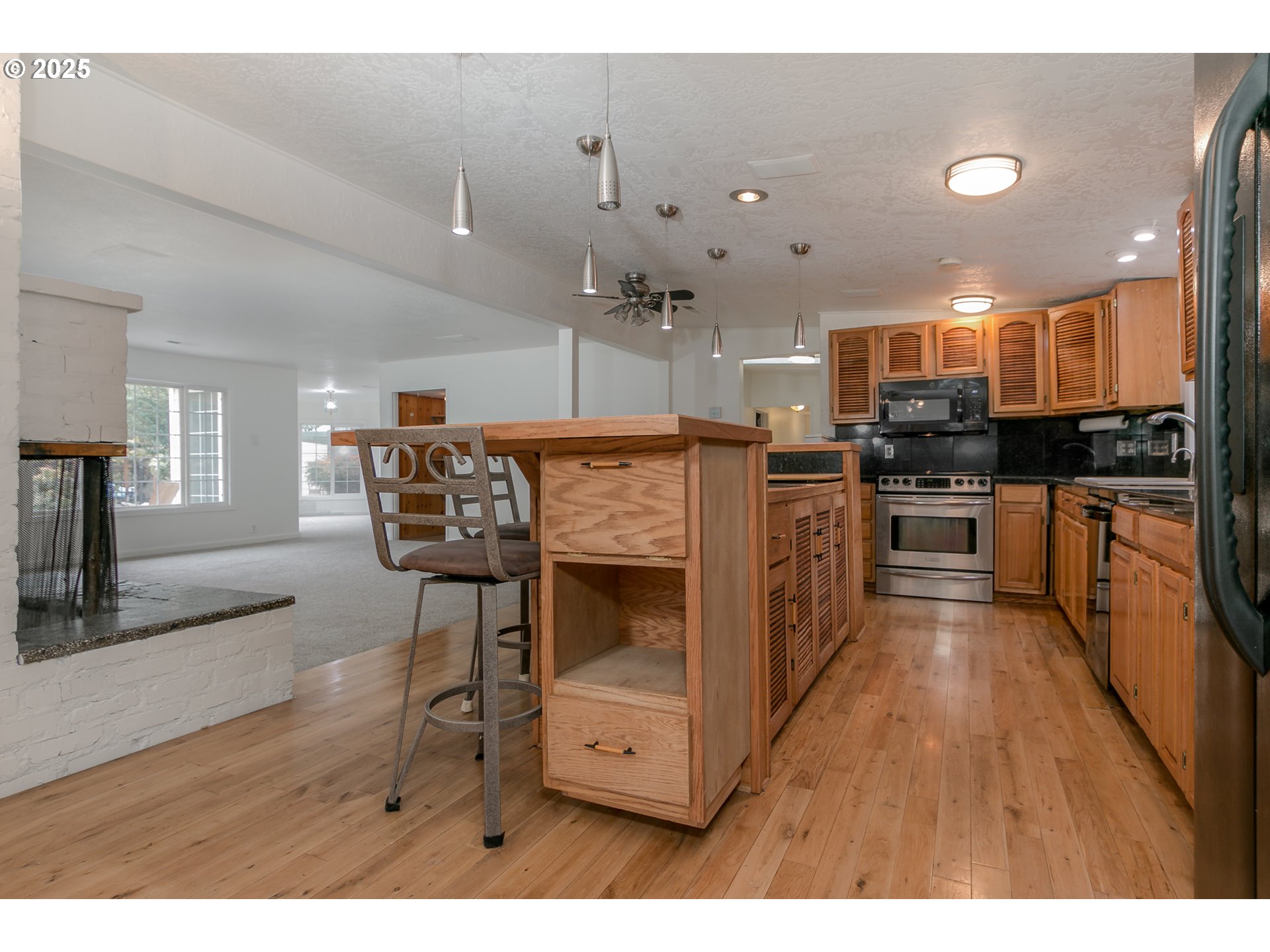 1755 East 43rd Avenue Eugene, OR 97405 - Photo 15 of 34 a view of kitchen with cabinets and wooden floor