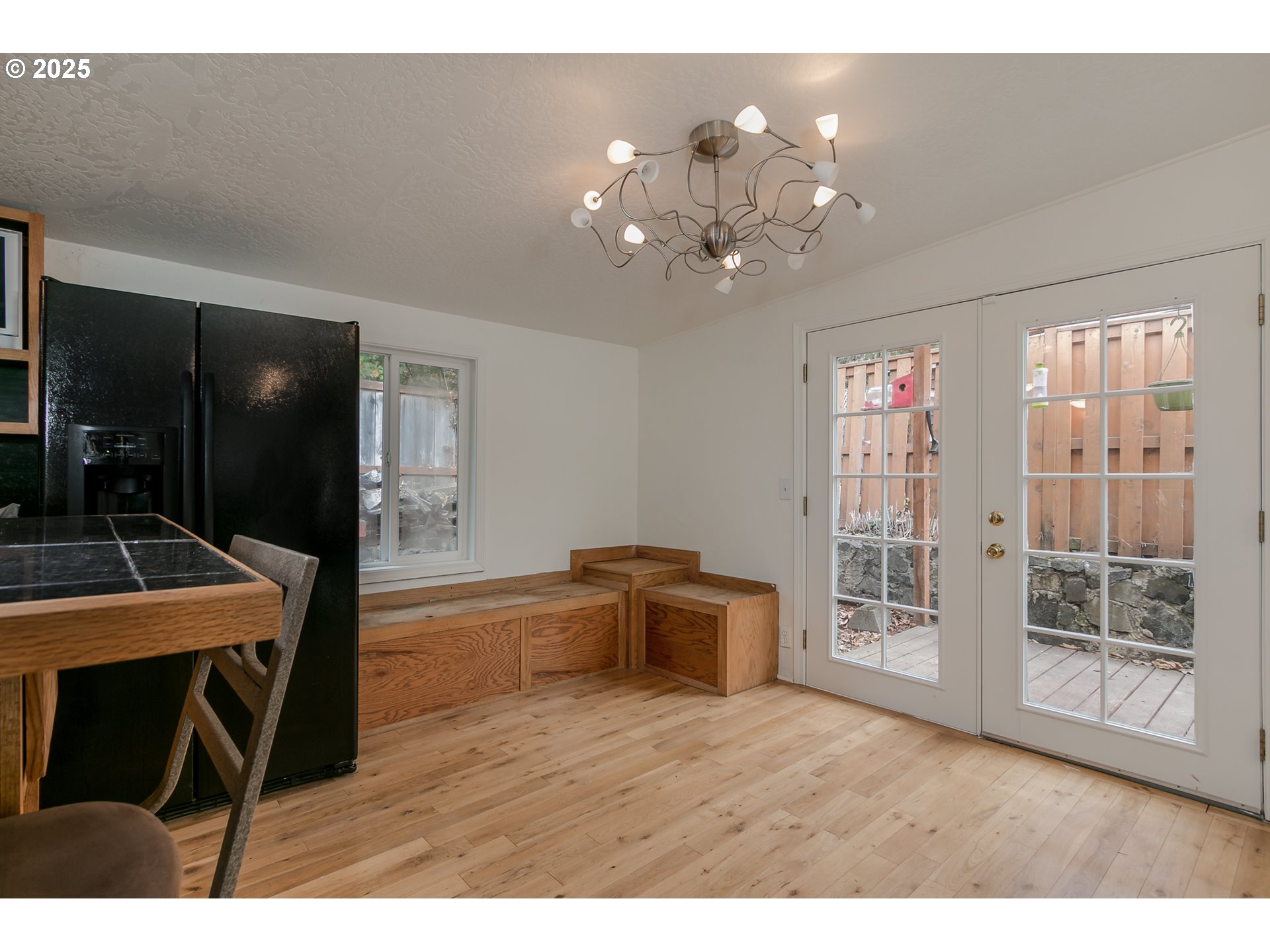 1755 East 43rd Avenue Eugene, OR 97405 - Photo 17 of 34 a living room with furniture and a chandelier