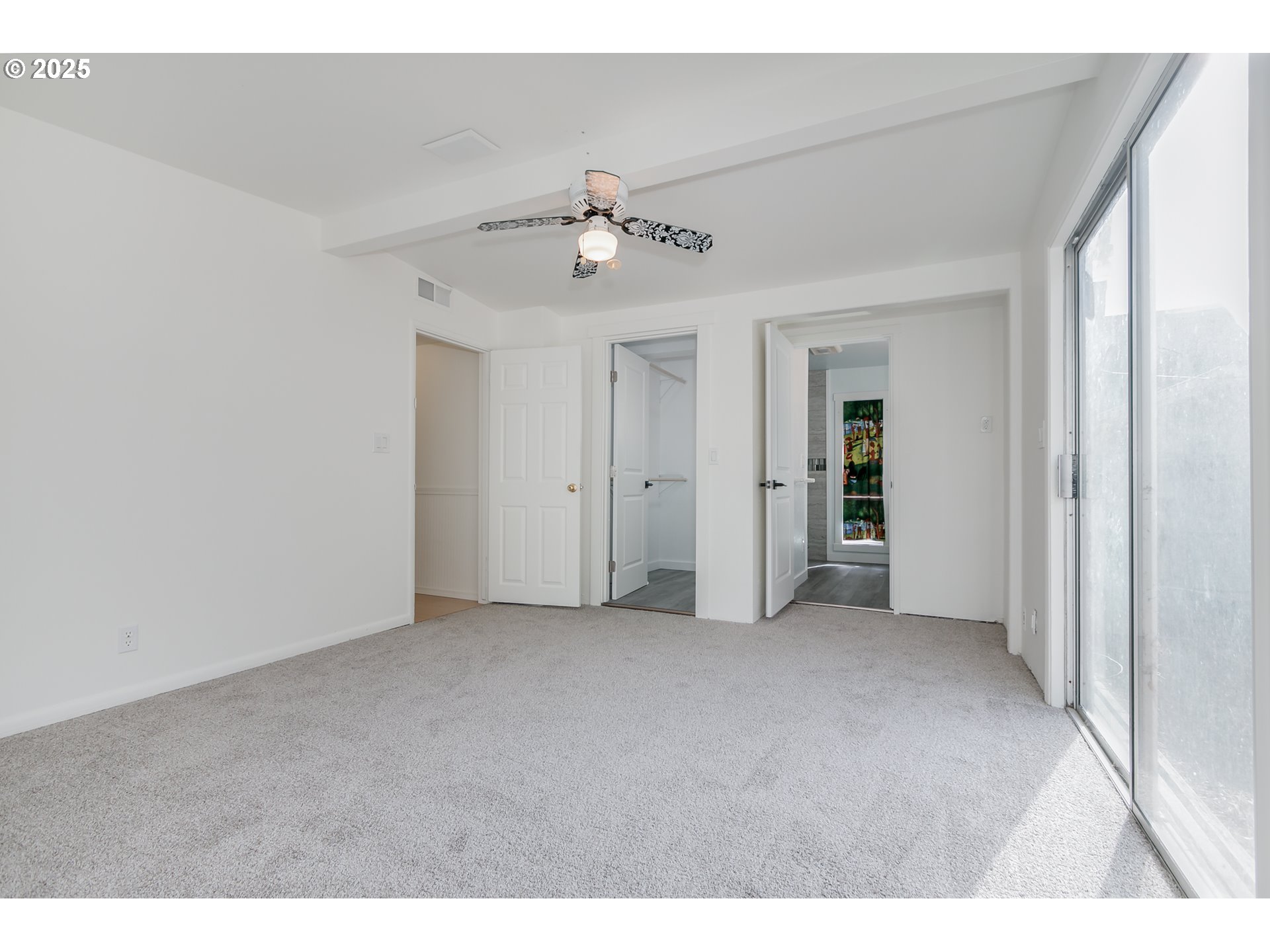 1755 East 43rd Avenue Eugene, OR 97405 - Photo 20 of 34 an empty room with fan and entrance