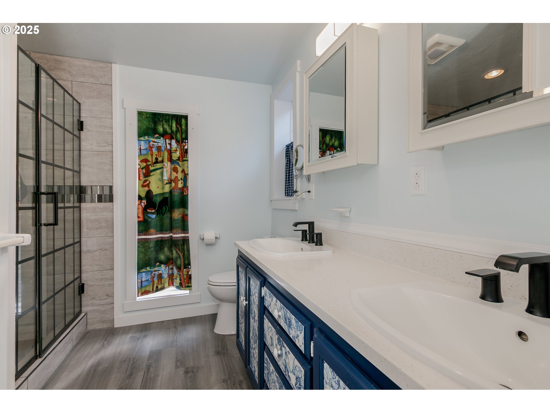 1755 East 43rd Avenue Eugene, OR 97405 - Photo 22 of 34 a bathroom with a sink a toilet and shower