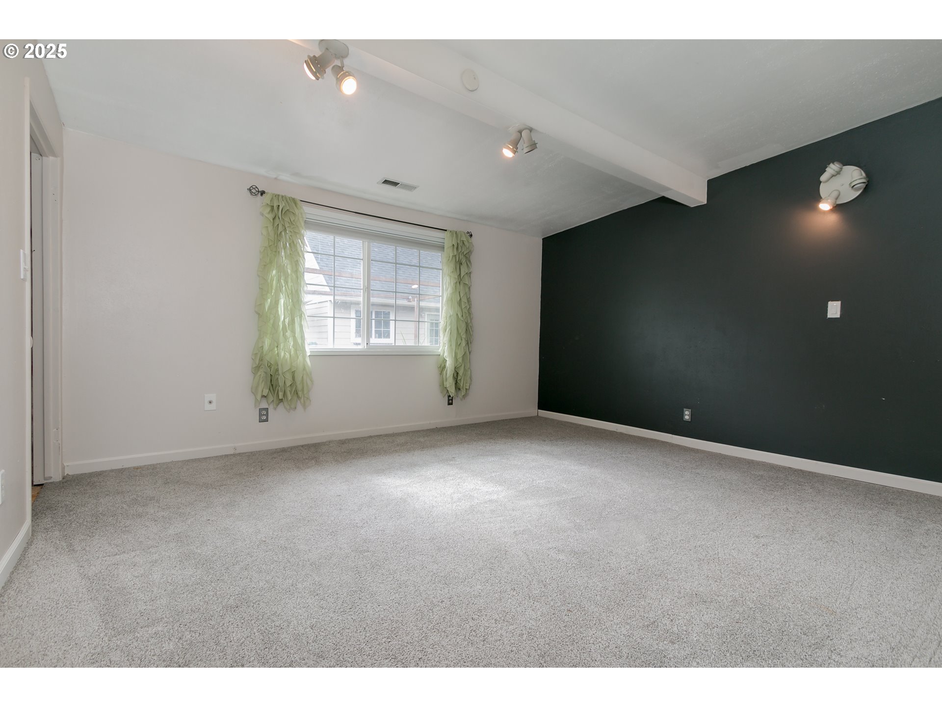 1755 East 43rd Avenue Eugene, OR 97405 - Photo 24 of 34 a view of an empty room with a window