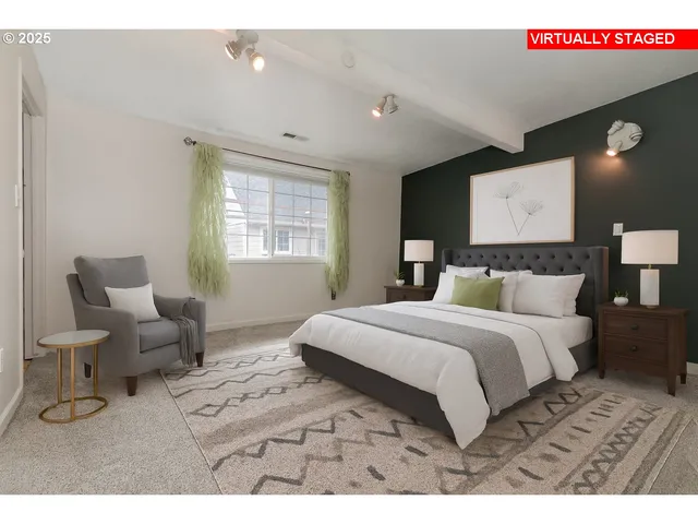 a bedroom with a large bed and a window