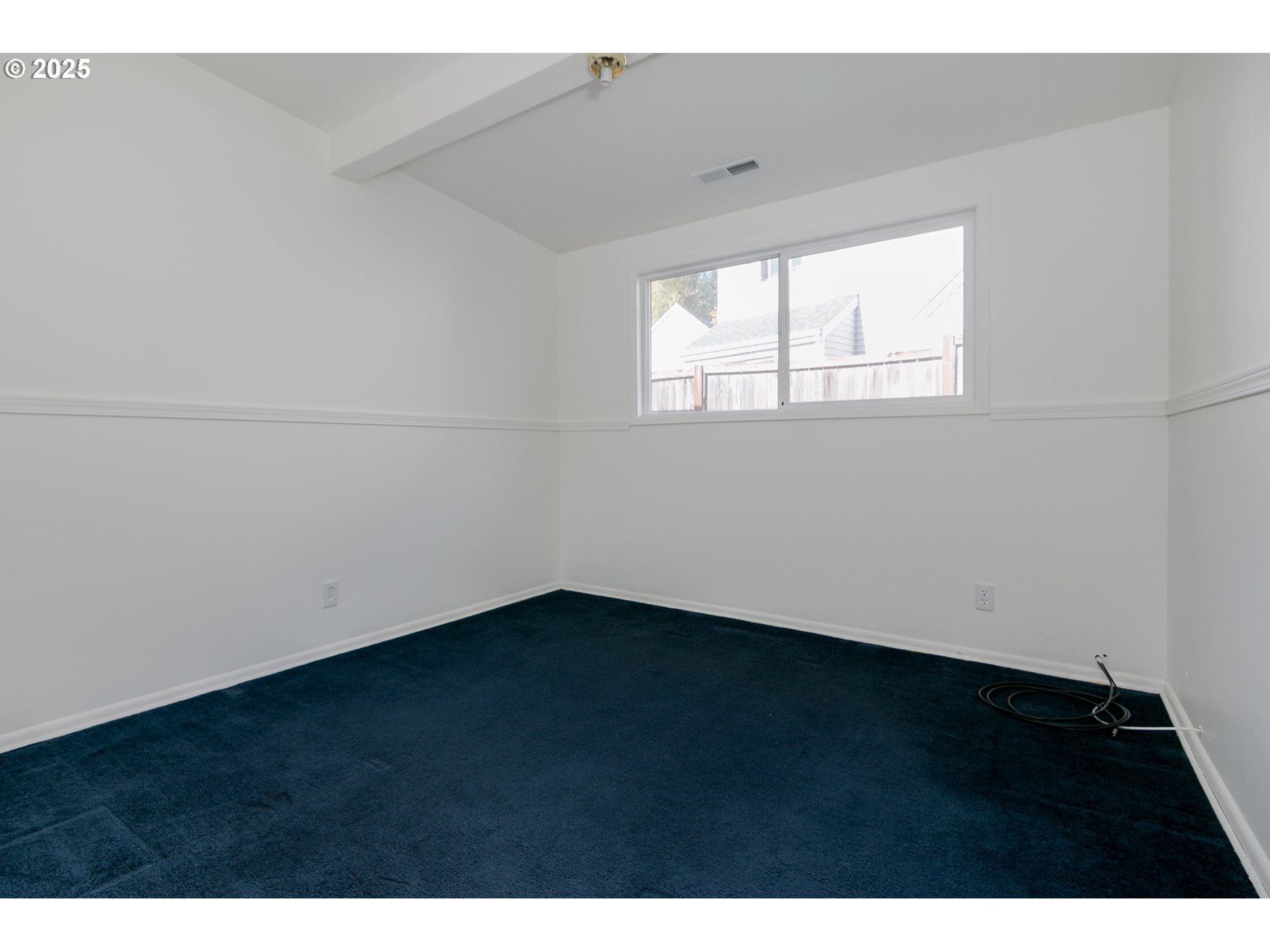 1755 East 43rd Avenue Eugene, OR 97405 - Photo 26 of 34 a view of an empty room with wooden floor