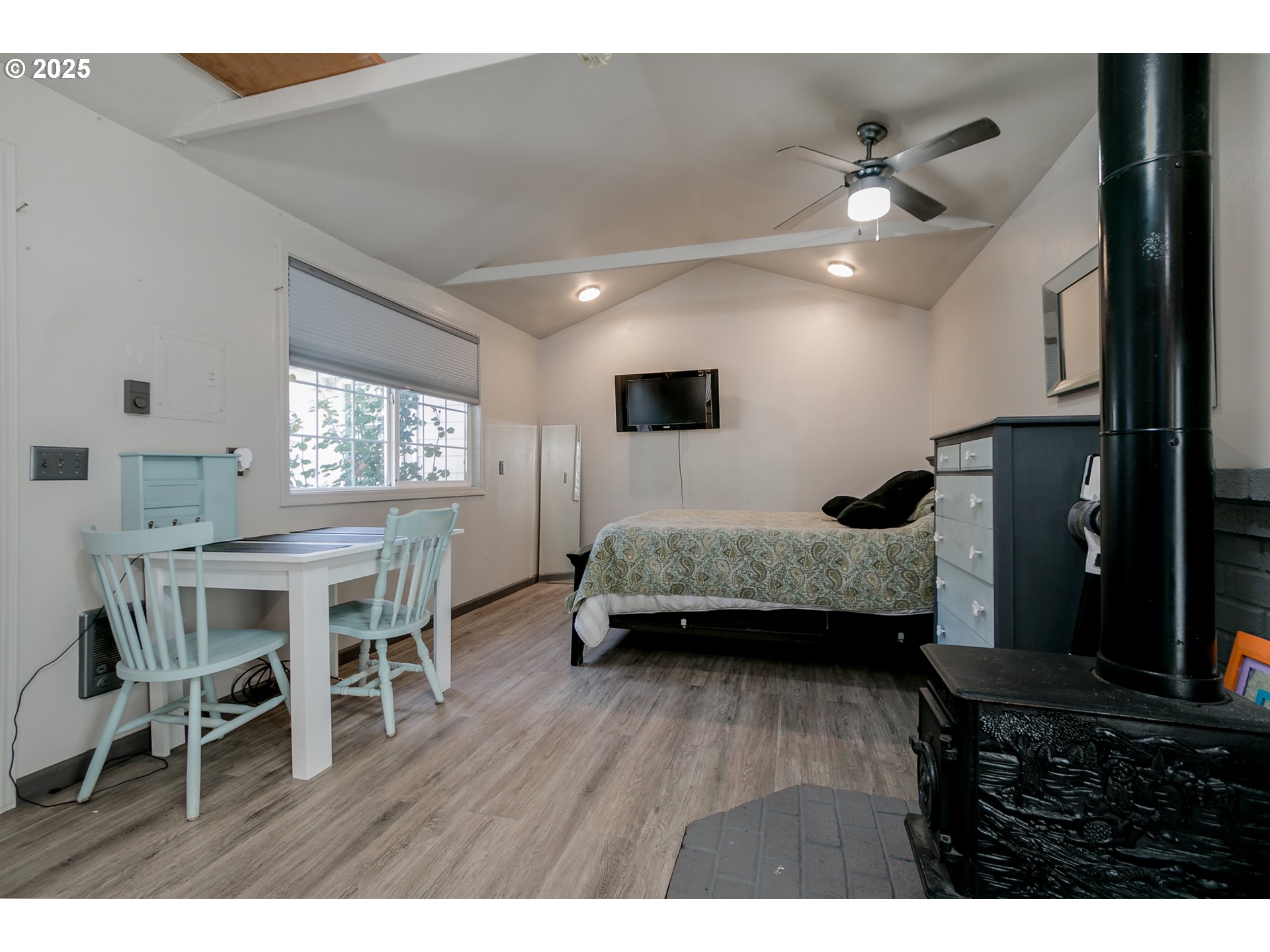 1755 East 43rd Avenue Eugene, OR 97405 - Photo 31 of 34 a bedroom with furniture and a wooden floor