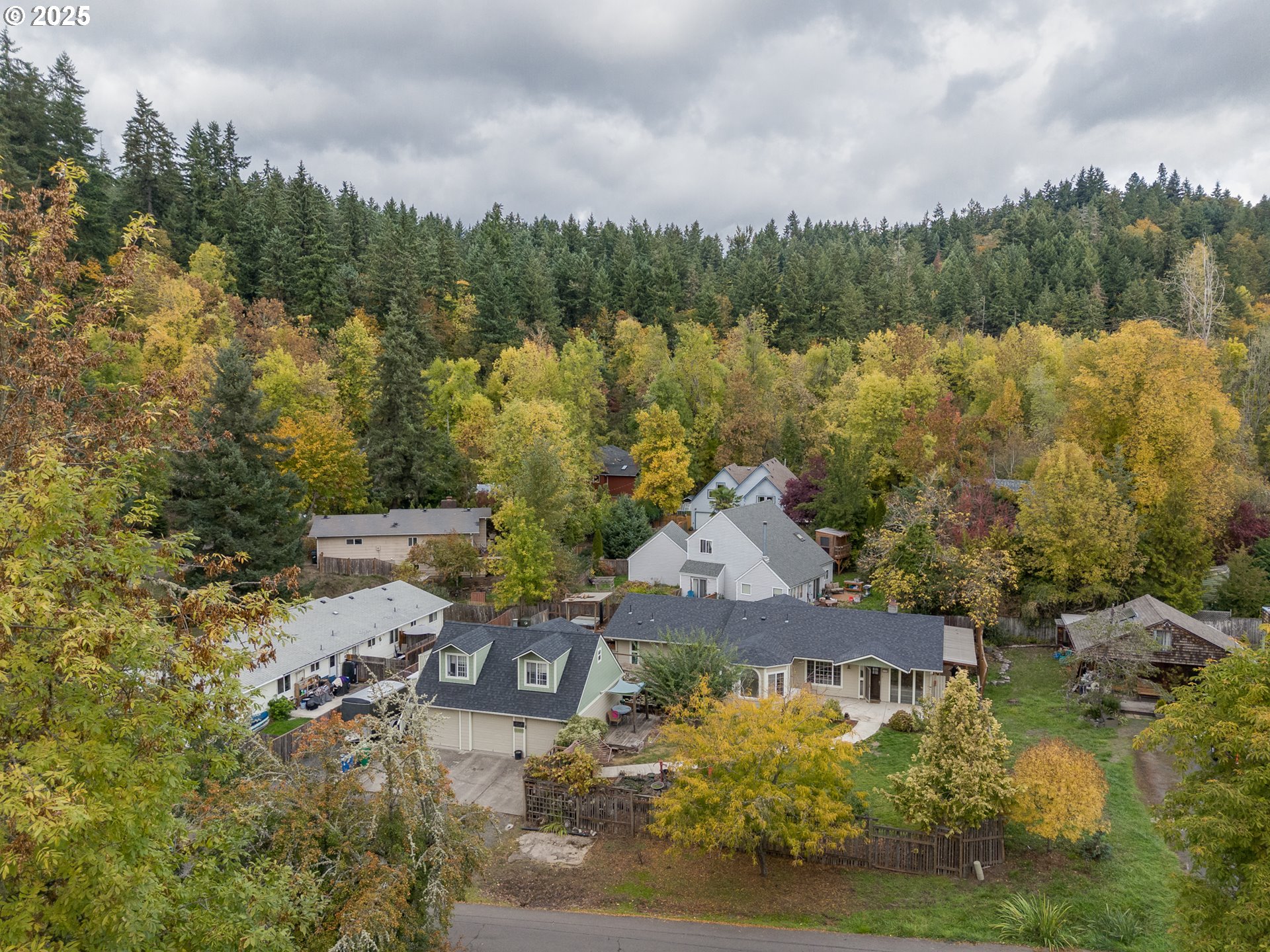 1755 East 43rd Avenue Eugene, OR 97405 - Photo 5 of 34 an aerial view of a house with a garden and lake view