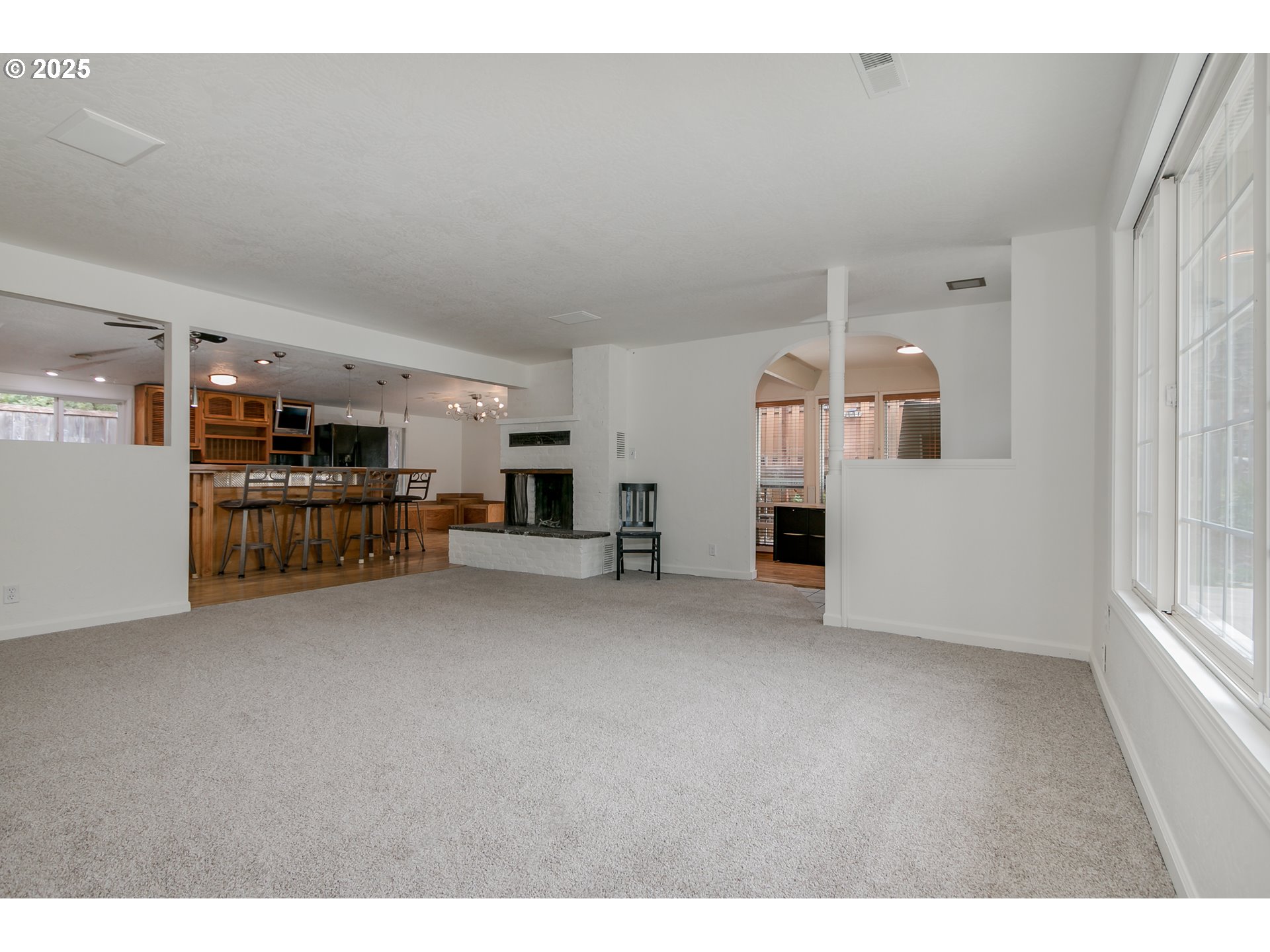 1755 East 43rd Avenue Eugene, OR 97405 - Photo 10 of 34 a view of a livingroom with furniture and an empty room