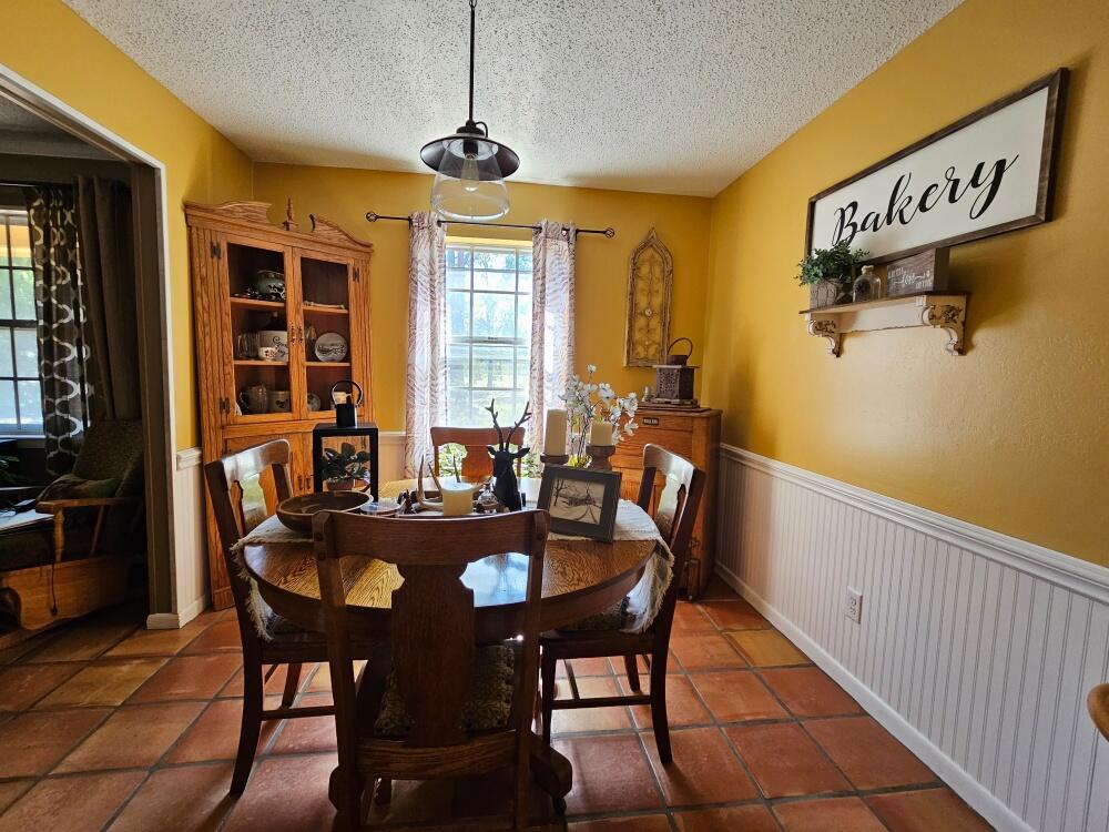 4017 Bear Creek Road Crestview, FL 32539 - Photo 2 of 30 a view of a dining room with furniture window and outside view