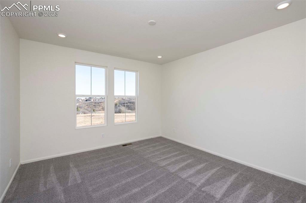 2120 Peachleaf Loop Castle Rock, CO 80108 - Photo 16 of 28 a view of an empty room with a window