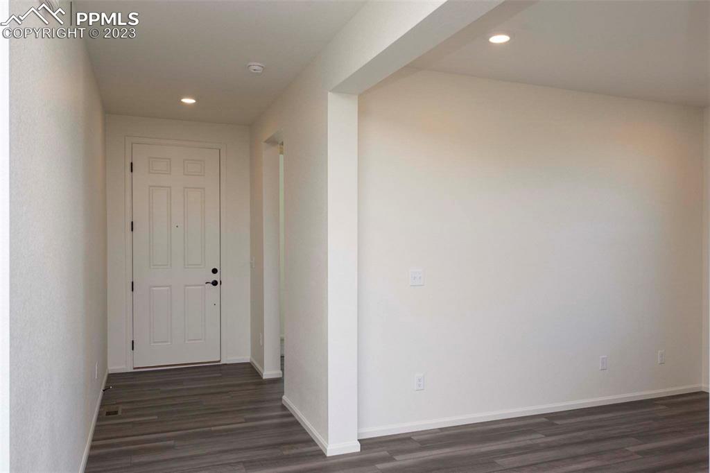 2120 Peachleaf Loop Castle Rock, CO 80108 - Photo 2 of 28 a view of a hallway with wooden floor