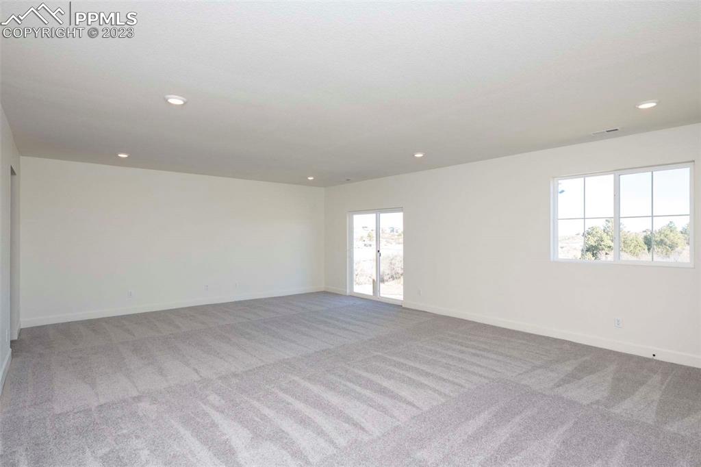 2120 Peachleaf Loop Castle Rock, CO 80108 - Photo 22 of 28 a view of an empty room with a window