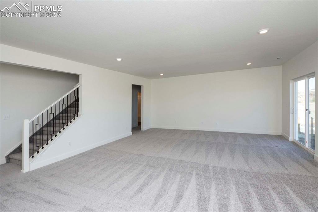 2120 Peachleaf Loop Castle Rock, CO 80108 - Photo 23 of 28 a view of an empty room with stairs