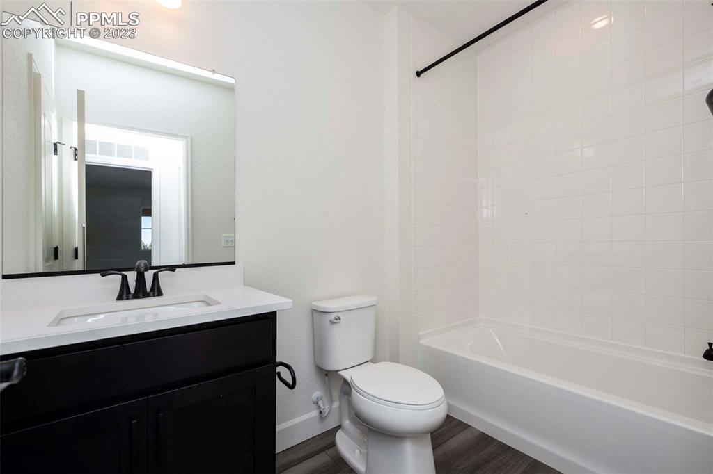 2120 Peachleaf Loop Castle Rock, CO 80108 - Photo 25 of 28 a bathroom with a sink a toilet and shower