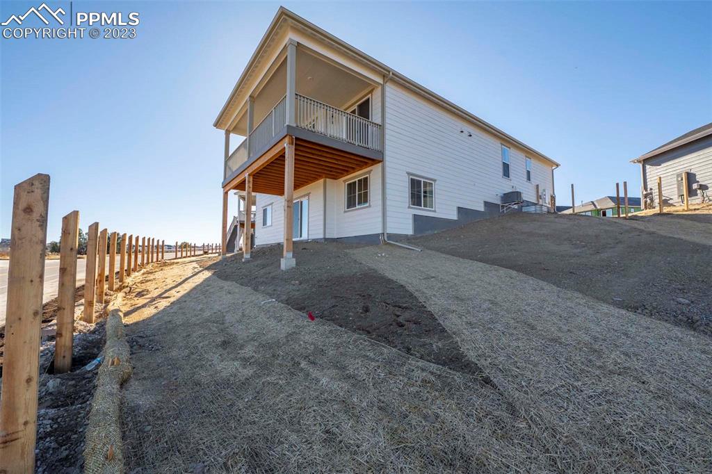 2120 Peachleaf Loop Castle Rock, CO 80108 - Photo 27 of 28 a front view of a house with a yard