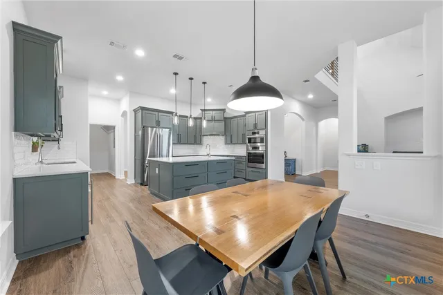 a bathroom with a toilet sink and shower