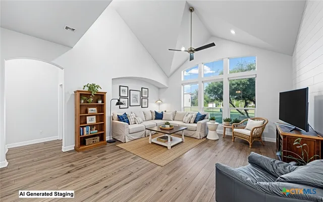 a bedroom with a large bed and a large window