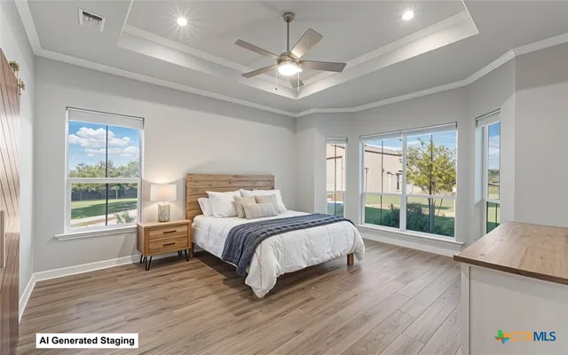 a spacious bedroom with a bed and a window