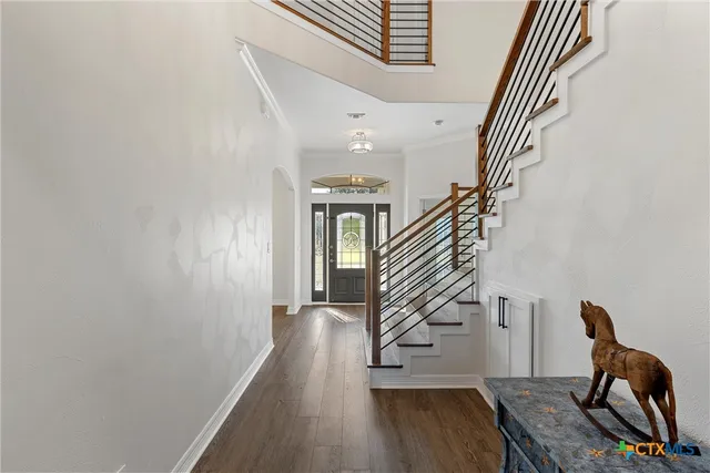 a large kitchen with a table and chairs
