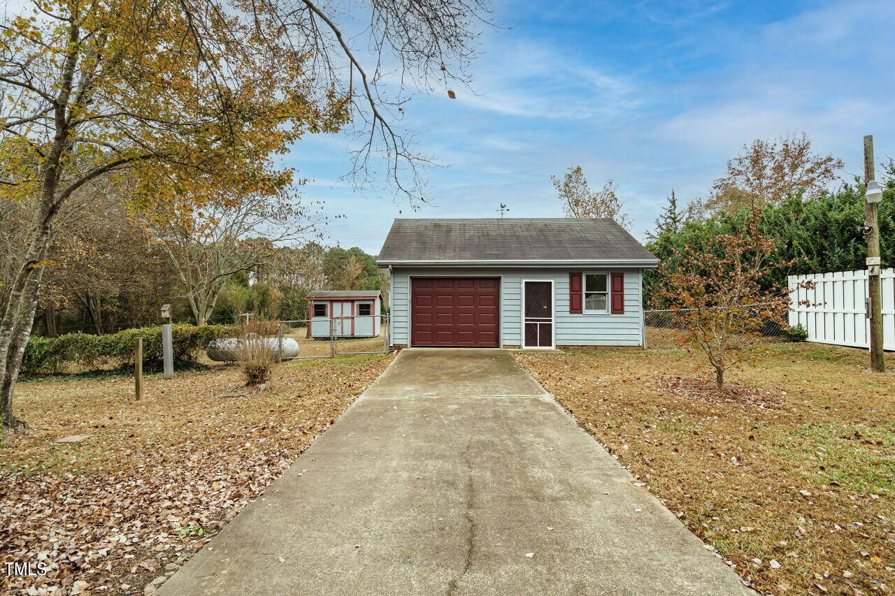 5917 Countryview Lane Raleigh, NC 27606 - Photo 22 of 43 Prepare to be amazed by the detached garage/workshop, a space that truly opens the door to endless possibilities. With its sturdy construction and ample square footage, this versatile area offers a world of potential limited only by your imagination.