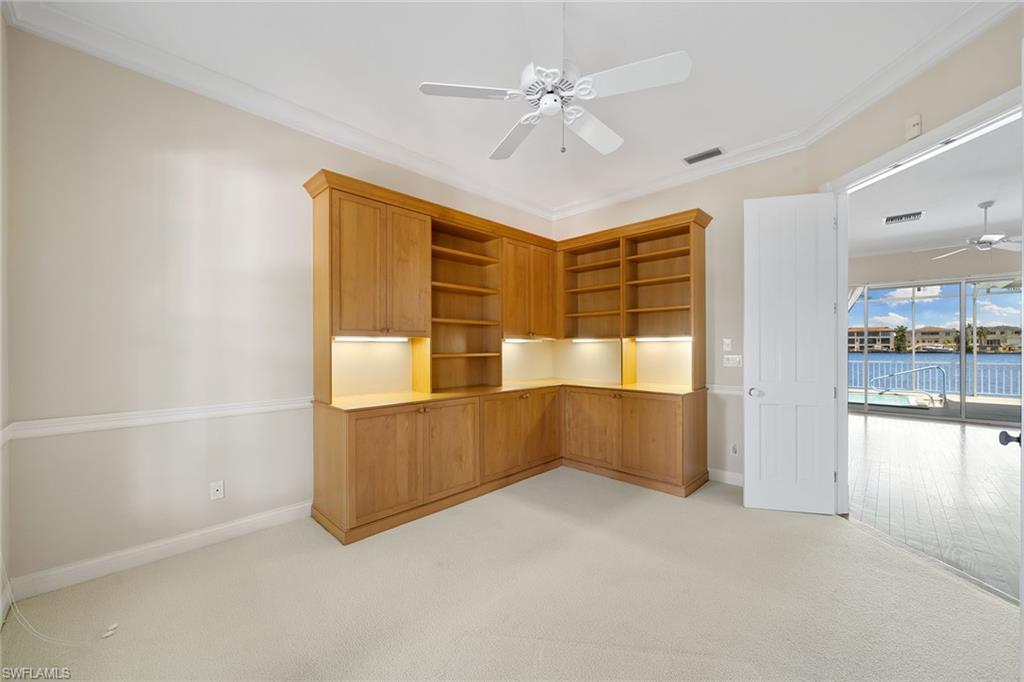283 Oak Avenue Naples, FL 34108 - Photo 11 of 39 wooden floor in an empty room with a window