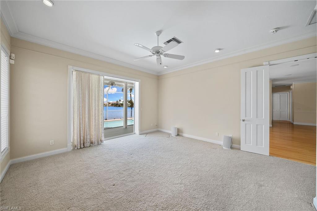 283 Oak Avenue Naples, FL 34108 - Photo 24 of 39 an empty room with fan and windows