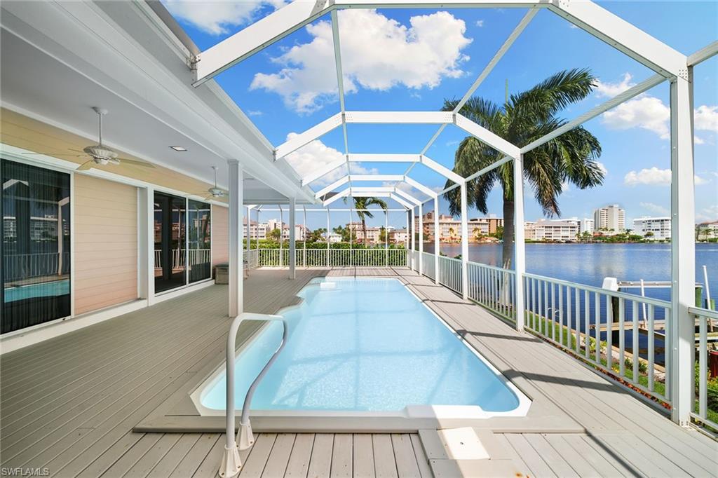 283 Oak Avenue Naples, FL 34108 - Photo 33 of 39 a view of a patio with wooden floor and city view