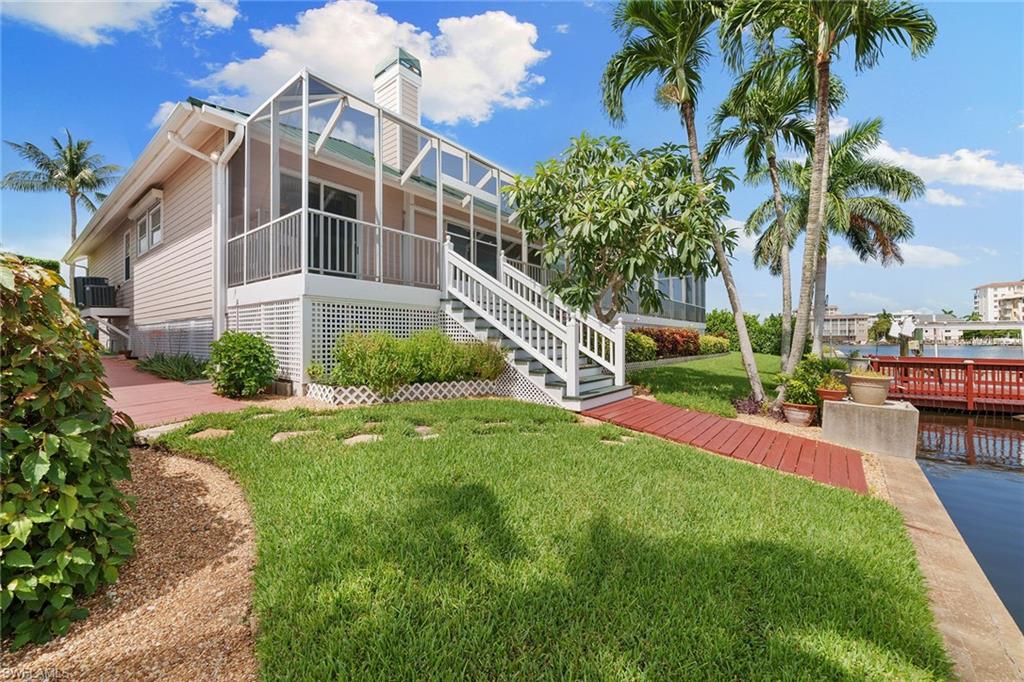 283 Oak Avenue Naples, FL 34108 - Photo 34 of 39 a view of a house with a yard and potted plants