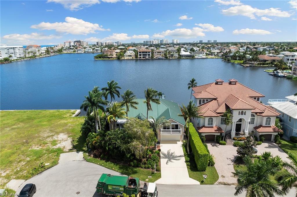 283 Oak Avenue Naples, FL 34108 - Photo 38 of 39 a view of a lake with a house