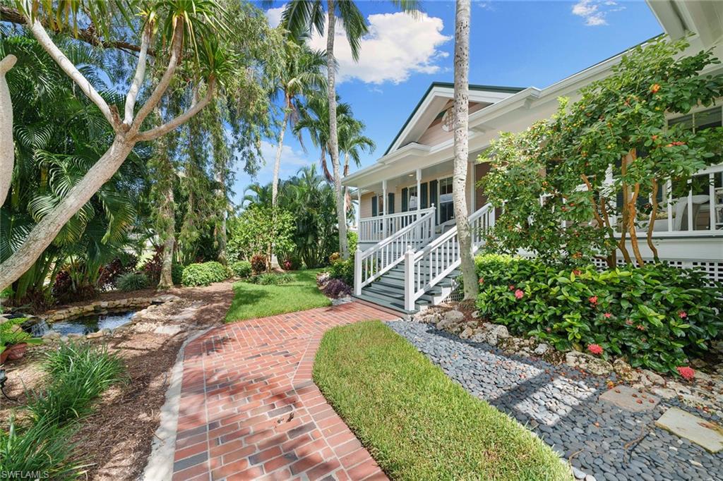 283 Oak Avenue Naples, FL 34108 - Photo 6 of 39 a view of a garden with a house