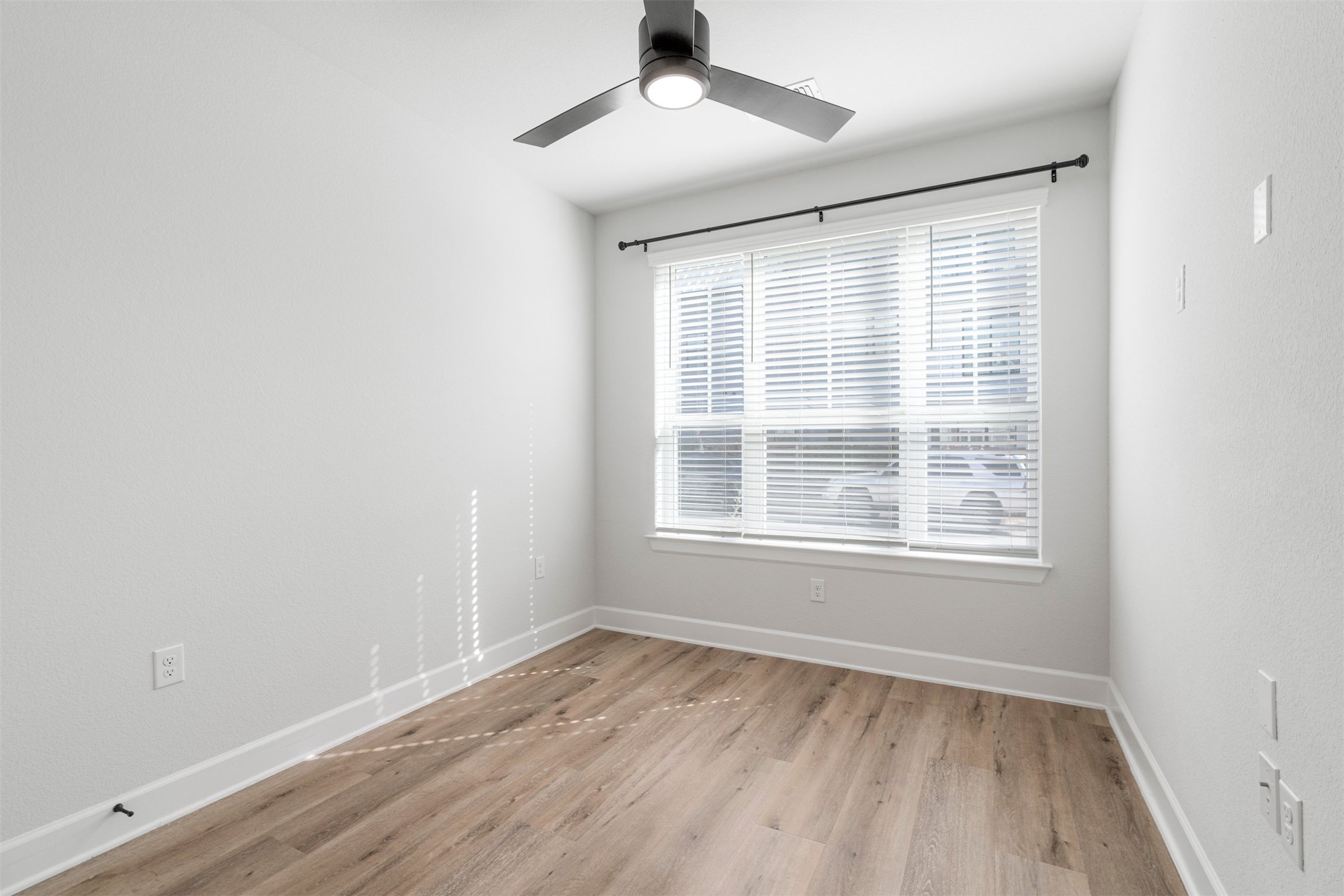 3900 Taniguchi Street Austin, TX 78723 - Photo 12 of 39 A spacious bedroom on the main floor offers guests a private place to stay.